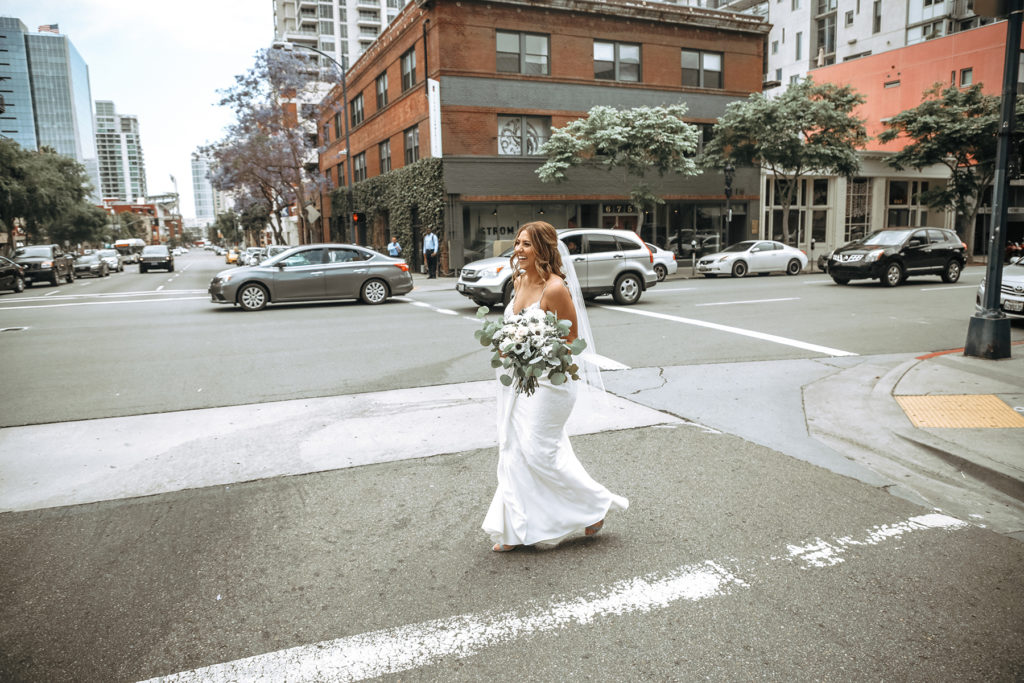 Bride walking downtown 